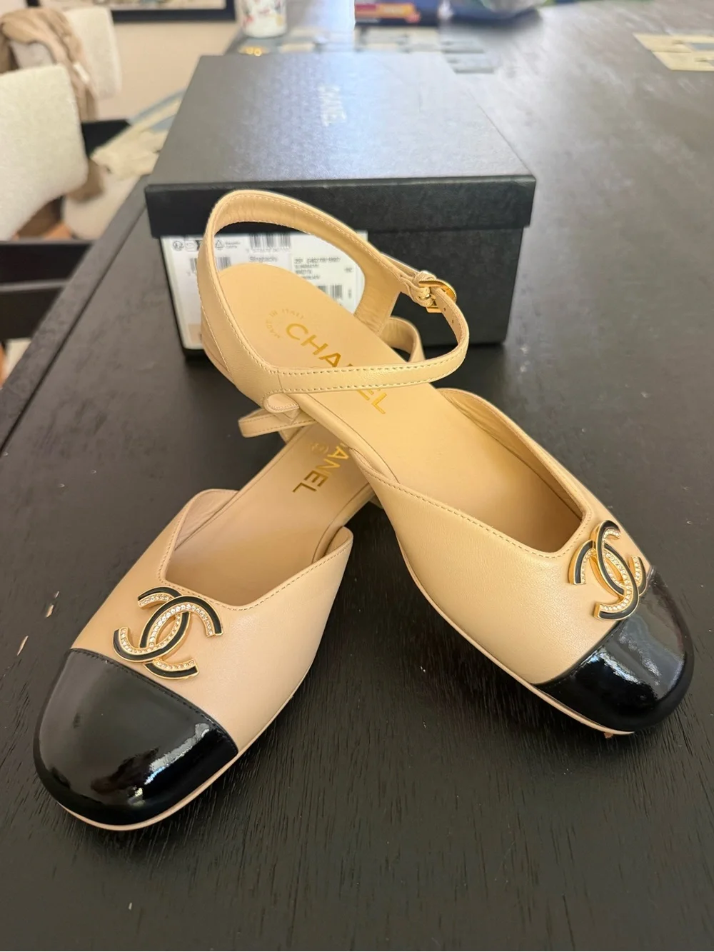 CHANEL Beige and Black Cap-Toe Logo Slingback Flats